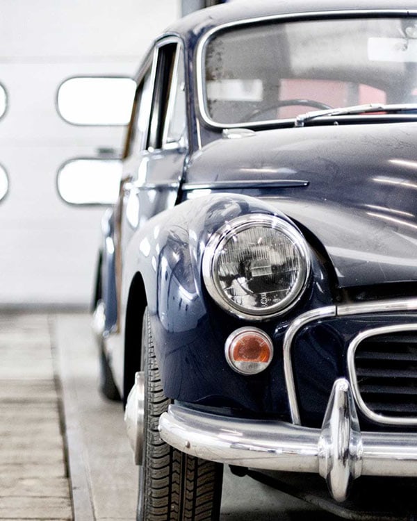 Vintage Volkswagen Beetle in a garage